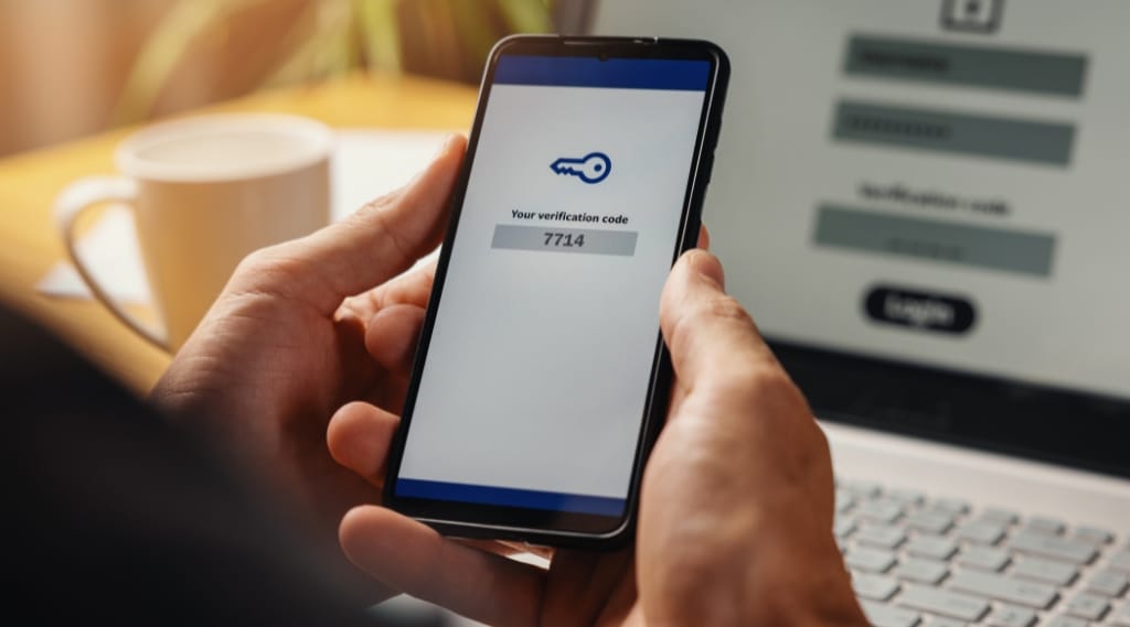 Someone using 2fa on a laptop